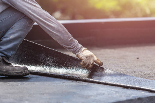 Professional Basement Waterproofing technician working in Sanders, KY